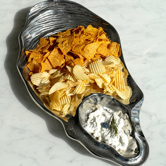 Seashell silver decorative platter with intricate shell design, coastal-inspired luxury home décor accent.