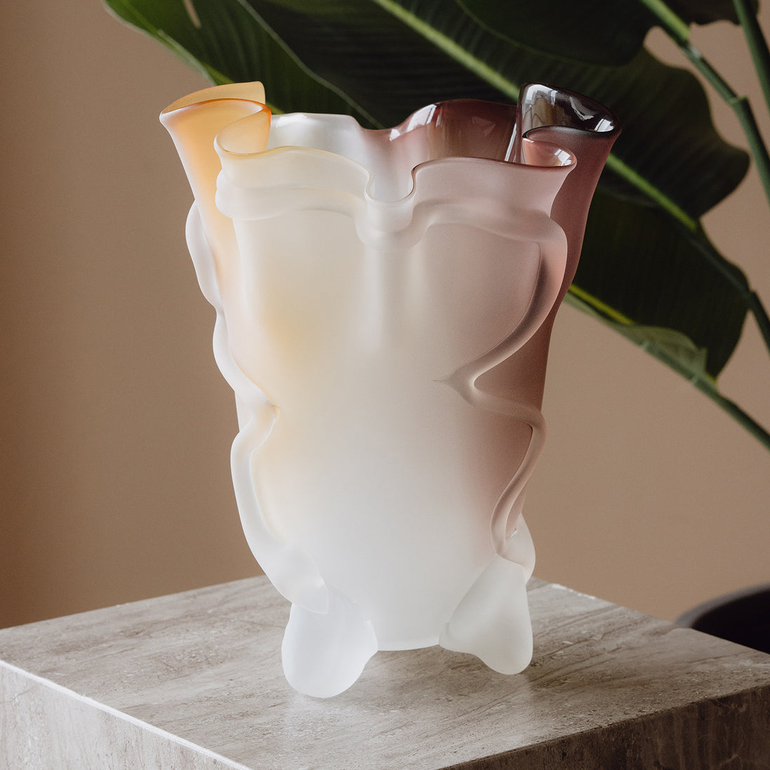 Frosted decorative glass vase with a red-to-yellow ombre finish and a sculptural floral-inspired silhouette for modern luxury interiors.