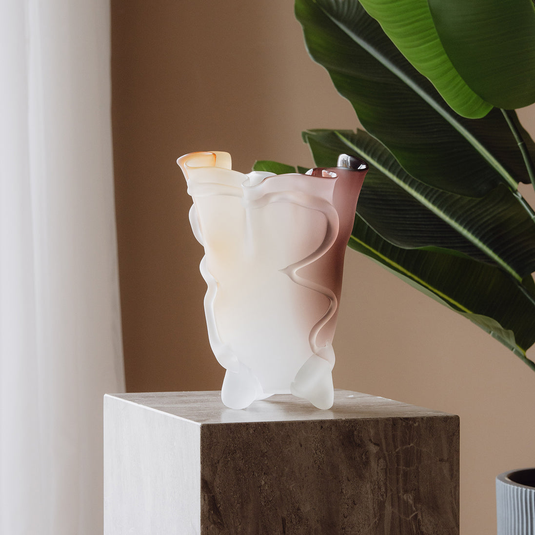 Frosted decorative glass vase with a red-to-yellow ombre finish and a sculptural floral-inspired silhouette for modern luxury interiors.