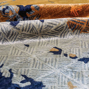Handmade abstract rug with bold layered colours and geometric patterns for contemporary and luxury interiors.