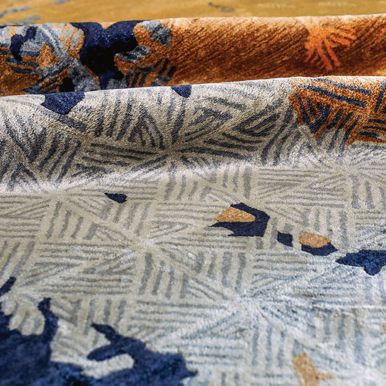 Handmade abstract rug with bold layered colours and geometric patterns for contemporary and luxury interiors.
