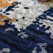 Handmade abstract rug with bold layered colours and geometric patterns for contemporary and luxury interiors.
