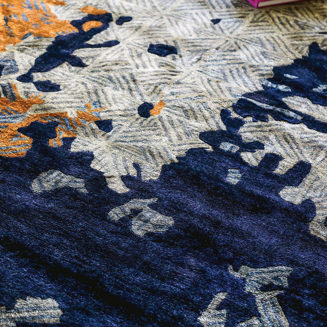 Handmade abstract rug with bold layered colours and geometric patterns for contemporary and luxury interiors.