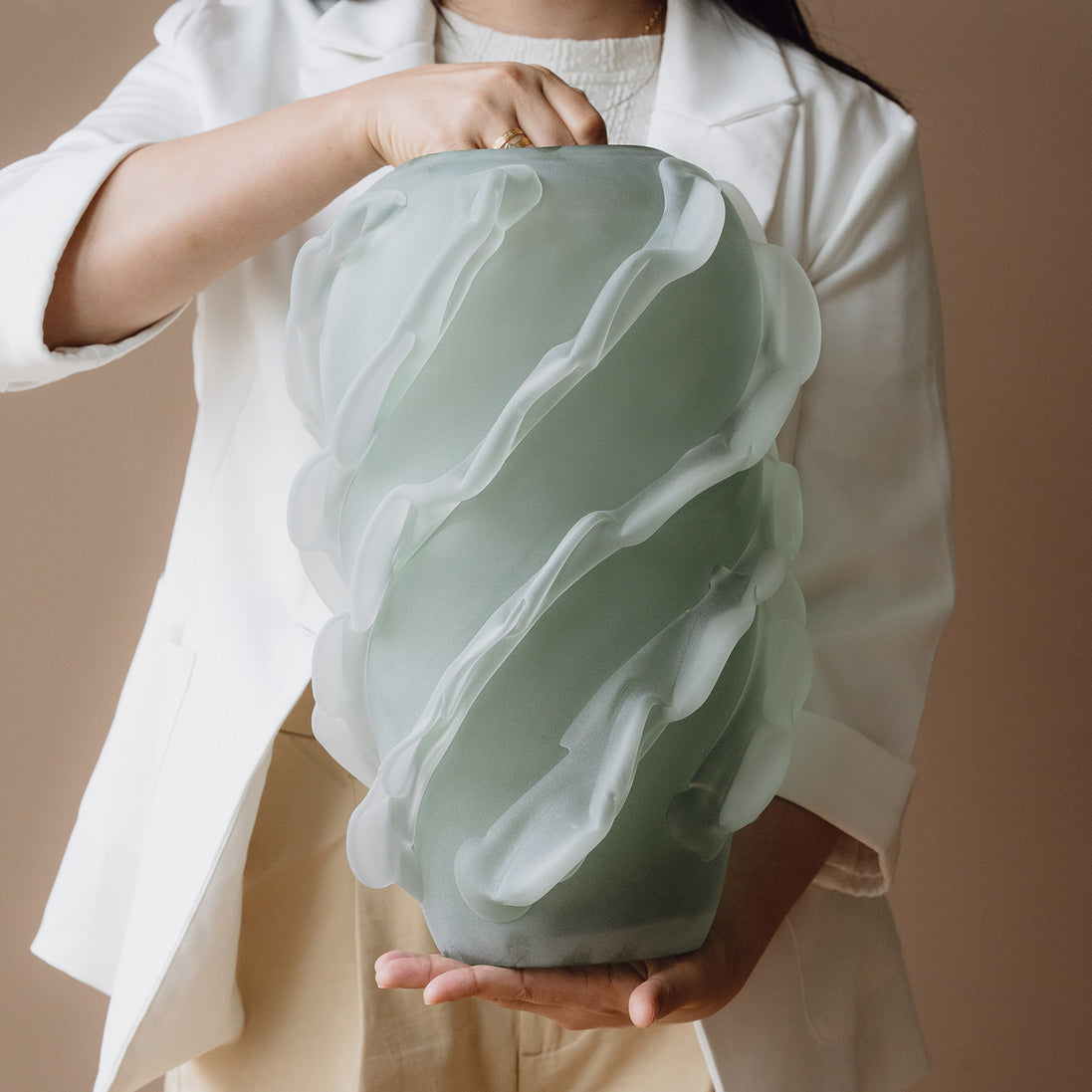 Verde is a frosted green glass vase with a sculptural wave texture, perfect for contemporary, minimalist, and luxury interiors.