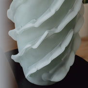 Verde is a frosted green glass vase with a sculptural wave texture, perfect for contemporary, minimalist, and luxury interiors.