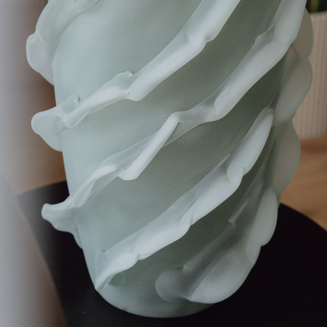 Verde is a frosted green glass vase with a sculptural wave texture, perfect for contemporary, minimalist, and luxury interiors.