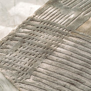 Handmade bamboo silk rug with a subtle organic border inspired by the Japanese Wabi-Sabi aesthetic in soft neutral tones.