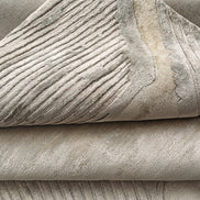 Handmade bamboo silk rug with a subtle organic border inspired by the Japanese Wabi-Sabi aesthetic in soft neutral tones.