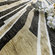 Handmade floral rug featuring a vibrant yellow blooming flower with warm neutral accents on a soft neutral background.